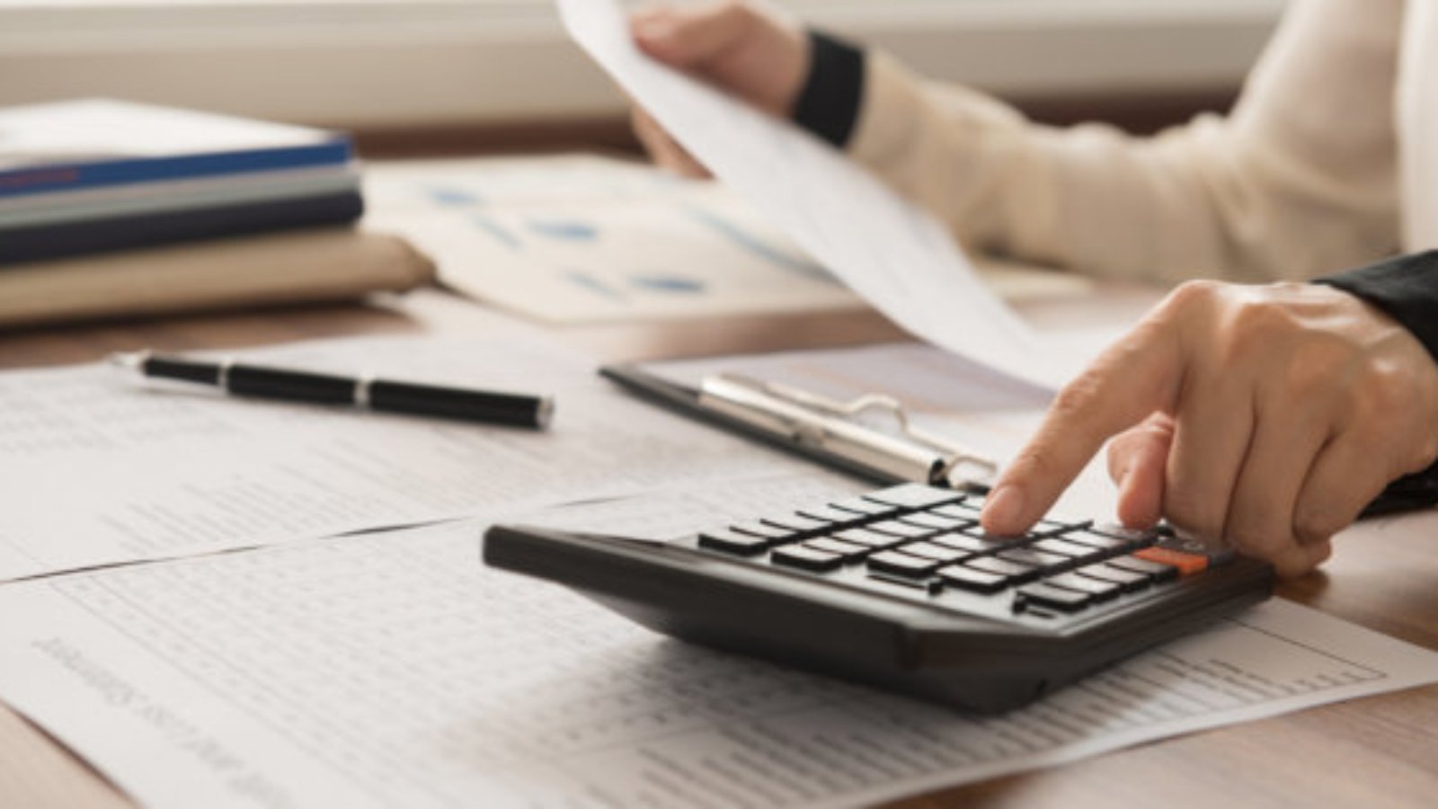 bookkeeper inspector calculated and checking balance account. accounting and auditing concept.
