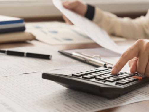 bookkeeper inspector calculated and checking balance account. accounting and auditing concept.